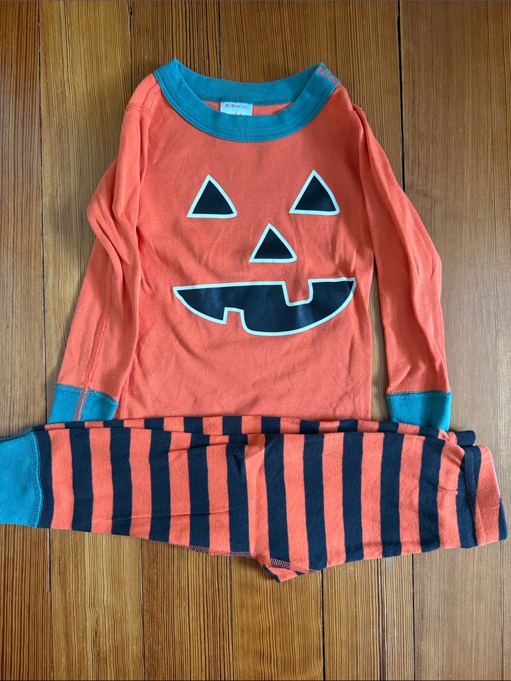 Hanna Andersson Orange Pumpkin Face Pajama Set with Teal Trim